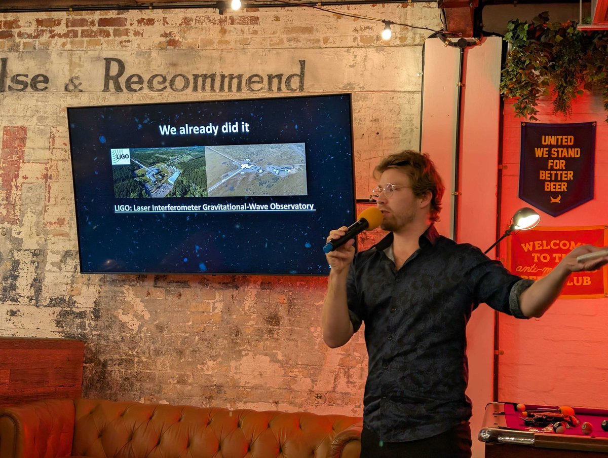 Hugh McDougall presenting on extragalactic black holes at Pint of Science